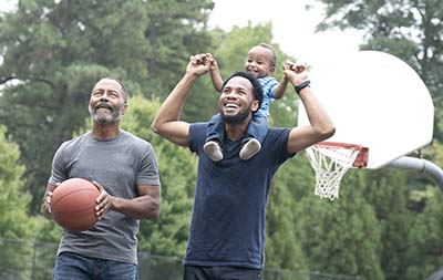 multi-generation family playing basketball photo